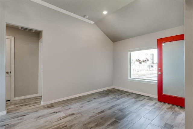 1624 NE 32nd St, Moore, OK 73160 - spare room with vaulted ceiling, wood finished floors, and recessed lighting