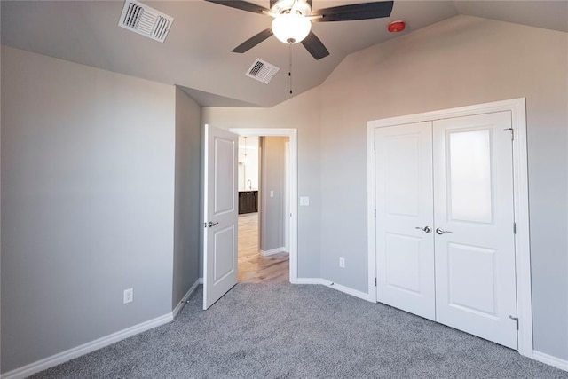 1624 NE 32nd St, Moore, OK 73160 - unfurnished bedroom featuring vaulted ceiling, carpet, a closet, and a ceiling fan