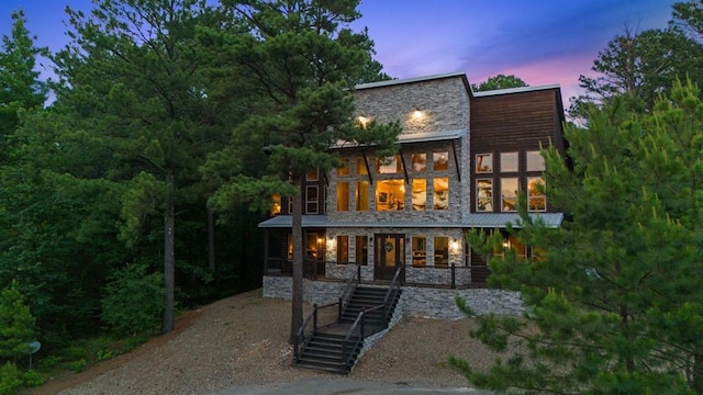 229 Sweet Gum Trl, Broken Bow, OK 74728 - rear view of property with stone siding, covered porch, and stairway