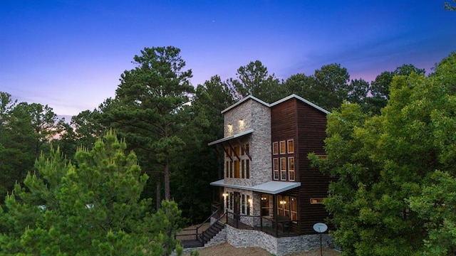 229 Sweet Gum Trl, Broken Bow, OK 74728 - view of front of home featuring stone siding, a porch, and log veneer siding