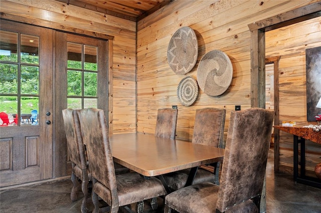 229 Sweet Gum Trl, Broken Bow, OK 74728 - dining space featuring wooden walls, finished concrete flooring, and wood ceiling