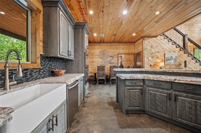 229 Sweet Gum Trl, Broken Bow, OK 74728 - kitchen featuring dishwasher, finished concrete floors, recessed lighting, wood walls, and wooden ceiling