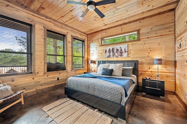 229 Sweet Gum Trl, Broken Bow, OK 74728 - bedroom with wooden walls, concrete flooring, and wooden ceiling