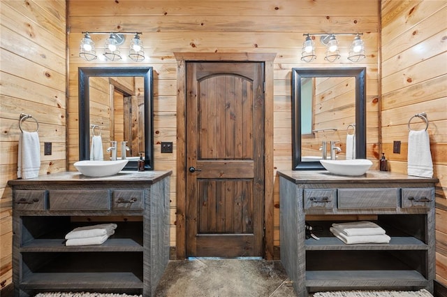 229 Sweet Gum Trl, Broken Bow, OK 74728 - bathroom featuring wooden walls and two vanities