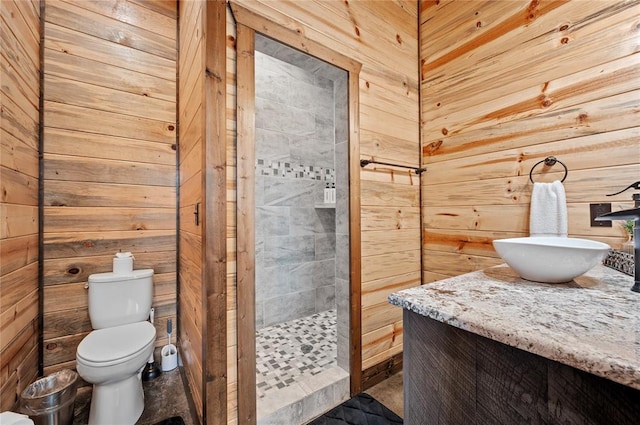 229 Sweet Gum Trl, Broken Bow, OK 74728 - full bathroom featuring tiled shower, vanity, and wood walls