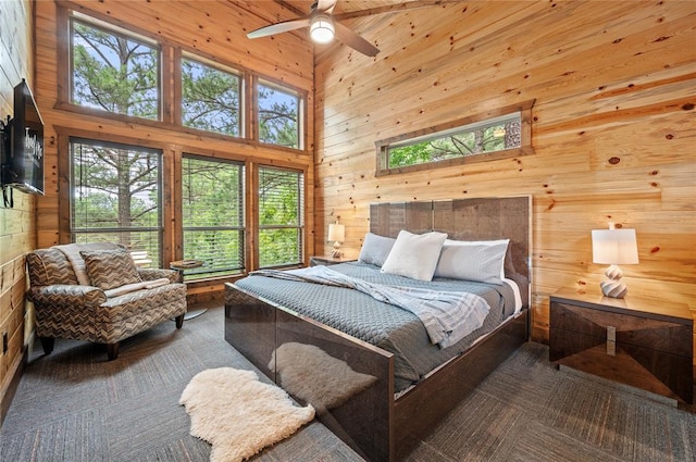 229 Sweet Gum Trl, Broken Bow, OK 74728 - bedroom featuring wooden walls and a towering ceiling