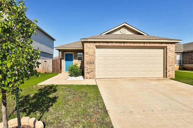 11725 Casey Dr, Yukon, OK 73099 - ranch-style house featuring brick siding, driveway, roof with shingles, and an attached garage