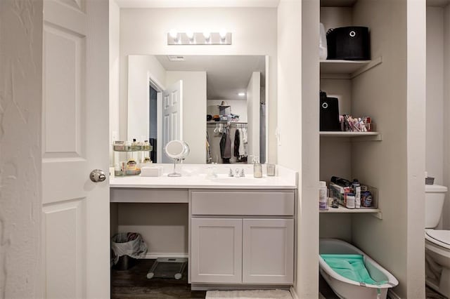 11725 Casey Dr, Yukon, OK 73099 - bathroom featuring vanity and wood finished floors