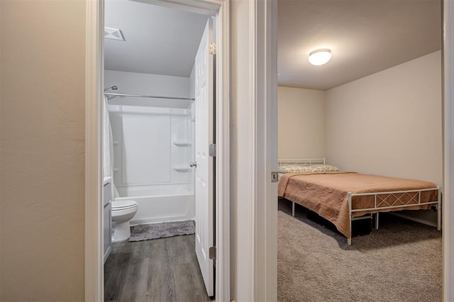 11725 Casey Dr, Yukon, OK 73099 - bedroom featuring wood finished floors and ensuite bathroom