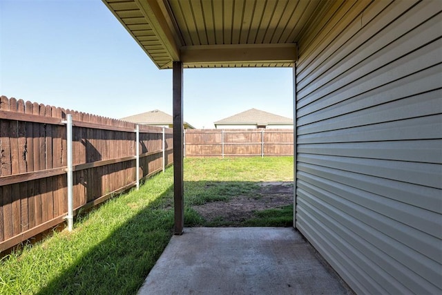 11725 Casey Dr, Yukon, OK 73099 - fenced backyard with a patio area
