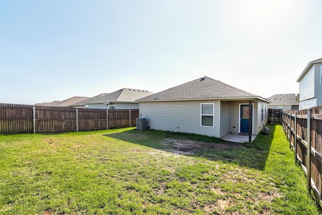 11725 Casey Dr, Yukon, OK 73099 - rear view of property featuring a fenced backyard and roof with shingles