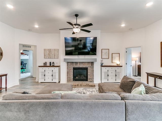 6516 SE 87th St, Oklahoma City, OK 73135 - living room featuring ceiling fan, wood finished floors, recessed lighting, and a fireplace