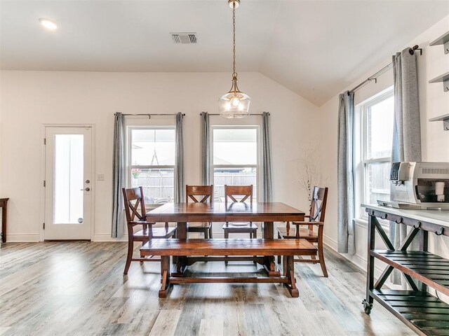 6516 SE 87th St, Oklahoma City, OK 73135 - dining space with lofted ceiling and light wood-style floors