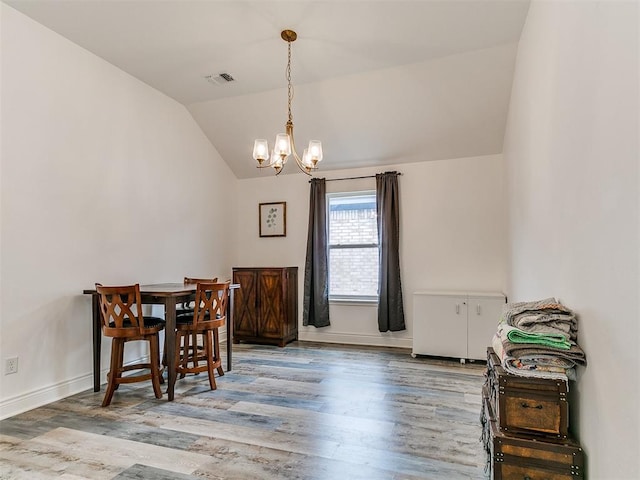 6516 SE 87th St, Oklahoma City, OK 73135 - dining space with a chandelier, wood finished floors, and lofted ceiling