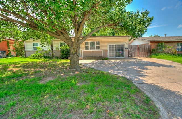 2317 N Redmond Ave, Bethany, OK 73008 - view of front of property featuring brick siding and concrete driveway