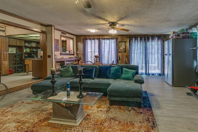 2317 N Redmond Ave, Bethany, OK 73008 - living room with ceiling fan, light wood-type flooring, and a textured ceiling