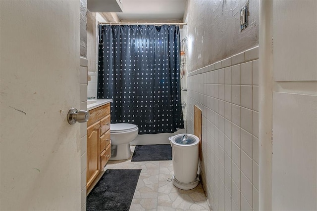 2317 N Redmond Ave, Bethany, OK 73008 - bathroom featuring vanity, tile walls, a shower with shower curtain, and tile patterned floors