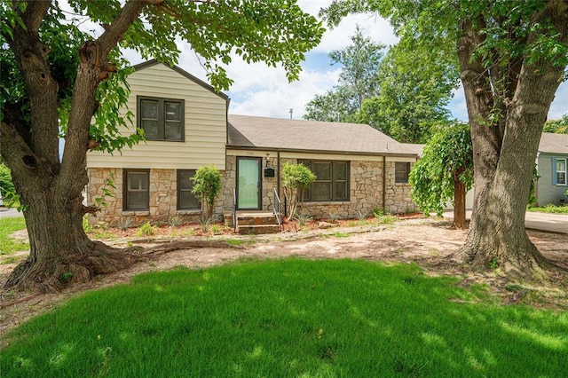 1200 NW 95th St, Oklahoma City, OK 73114 - tri-level home featuring stone siding, a front lawn, and a shingled roof