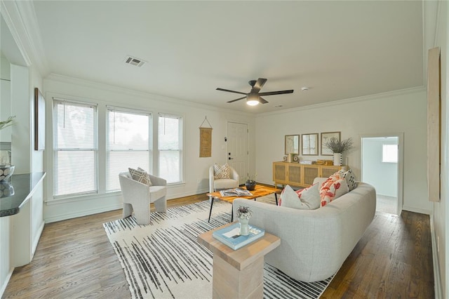 1200 NW 95th St, Oklahoma City, OK 73114 - living area featuring light wood finished floors, plenty of natural light, ornamental molding, and a ceiling fan