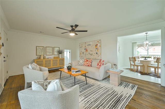 1200 NW 95th St, Oklahoma City, OK 73114 - living area with crown molding, wood finished floors, ceiling fan, and a chandelier