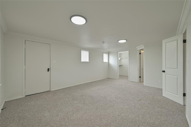1200 NW 95th St, Oklahoma City, OK 73114 - below grade area featuring light colored carpet and crown molding