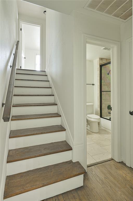 1200 NW 95th St, Oklahoma City, OK 73114 - stairs featuring wood finished floors
