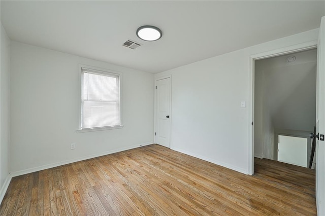 1200 NW 95th St, Oklahoma City, OK 73114 - empty room with light wood-style floors and baseboards