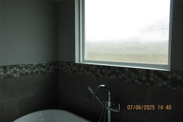 3909 Sorano Dr, Moore, OK 73160 - bathroom featuring healthy amount of natural light and a soaking tub
