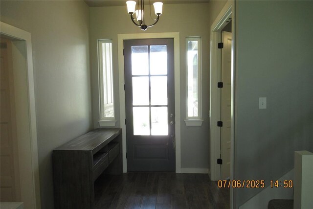 3909 Sorano Dr, Moore, OK 73160 - entrance foyer featuring dark wood-type flooring and a chandelier