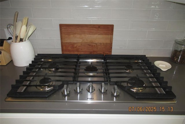 3909 Sorano Dr, Moore, OK 73160 - kitchen view of stainless steel gas cooktop and backsplash