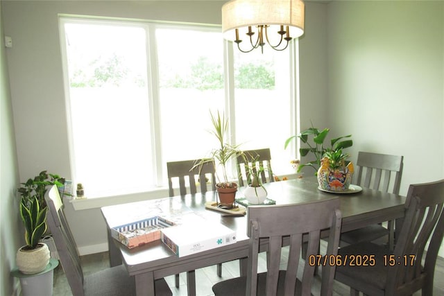 3909 Sorano Dr, Moore, OK 73160 - dining room with a chandelier and baseboards