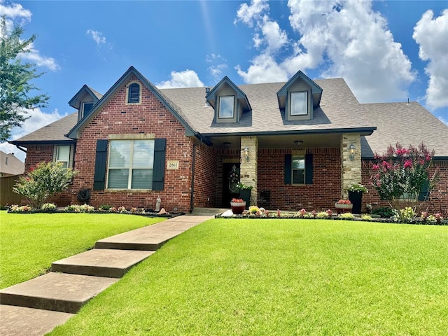 2803 Hidden Prairie Way, Edmond, OK 73013 - view of front of home featuring a front yard, brick siding, and roof with shingles
