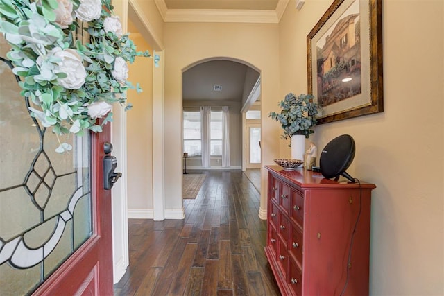 2803 Hidden Prairie Way, Edmond, OK 73013 - entryway with arched walkways, dark wood-style flooring, and crown molding