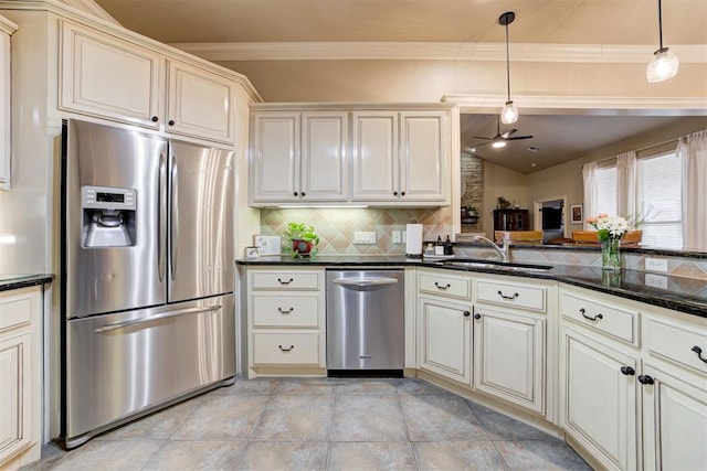 2803 Hidden Prairie Way, Edmond, OK 73013 - kitchen featuring appliances with stainless steel finishes, ceiling fan, tasteful backsplash, decorative light fixtures, and ornamental molding