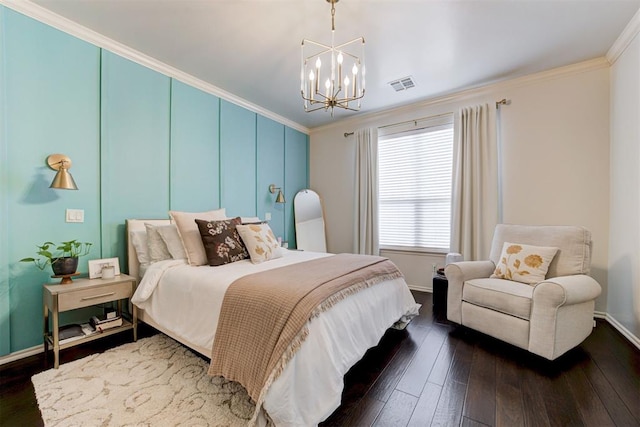2803 Hidden Prairie Way, Edmond, OK 73013 - bedroom featuring a chandelier, dark wood-type flooring, and crown molding