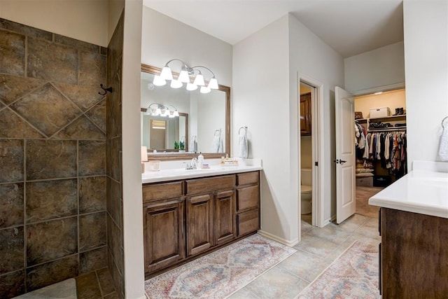 2803 Hidden Prairie Way, Edmond, OK 73013 - full bath with vanity, a spacious closet, and a tile shower