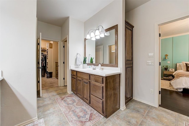 2803 Hidden Prairie Way, Edmond, OK 73013 - bathroom with vanity, ensuite bath, and a spacious closet