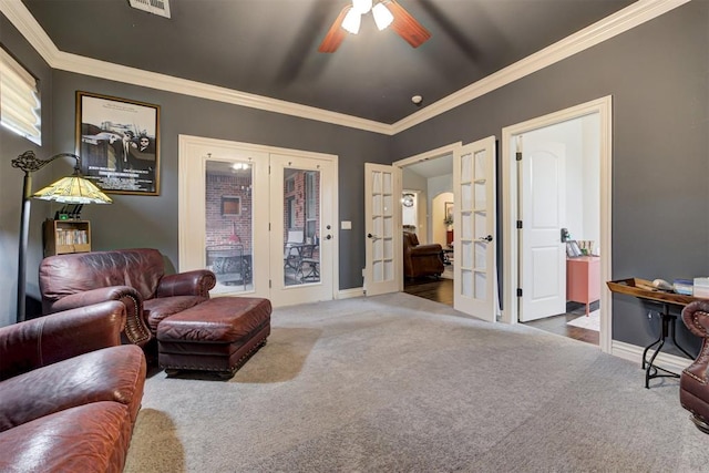 2803 Hidden Prairie Way, Edmond, OK 73013 - carpeted living room with french doors, ceiling fan, and ornamental molding