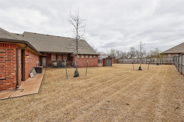 2803 Hidden Prairie Way, Edmond, OK 73013 - fenced backyard with a shed and a patio