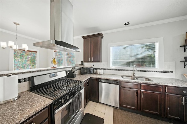 1530 NW 32nd St, Oklahoma City, OK 73118 - kitchen featuring stainless steel appliances, island range hood, crown molding, dark brown cabinets, and backsplash