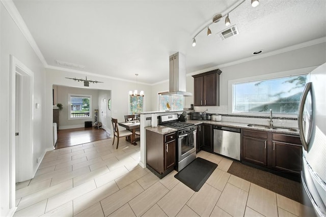 1530 NW 32nd St, Oklahoma City, OK 73118 - kitchen featuring stainless steel appliances, island exhaust hood, a peninsula, dark brown cabinetry, and light stone counters