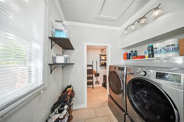 1530 NW 32nd St, Oklahoma City, OK 73118 - laundry room featuring separate washer and dryer, ornamental molding, and light tile patterned flooring