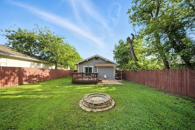 1530 NW 32nd St, Oklahoma City, OK 73118 - fenced backyard featuring an outdoor fire pit and a deck