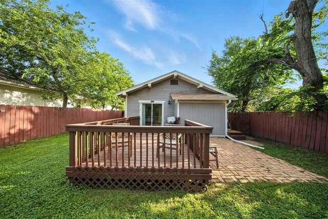 1530 NW 32nd St, Oklahoma City, OK 73118 - rear view of property with a fenced backyard and a wooden deck