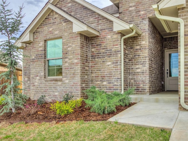 600 Mirano Ln, Edmond, OK 73034 - doorway to property featuring brick siding