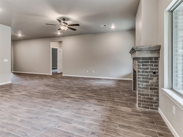 600 Mirano Ln, Edmond, OK 73034 - unfurnished living room with a ceiling fan, wood finished floors, a fireplace, and recessed lighting
