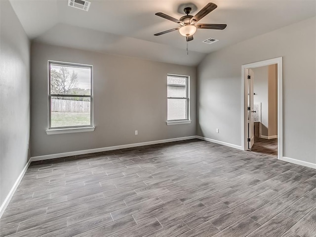 600 Mirano Ln, Edmond, OK 73034 - empty room featuring wood finished floors, a ceiling fan, and vaulted ceiling