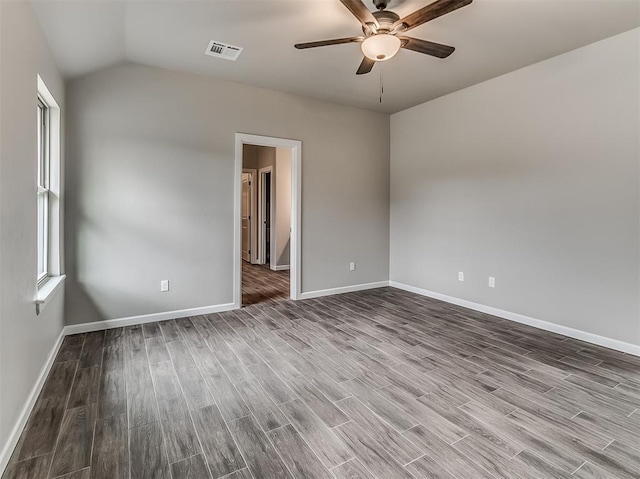 600 Mirano Ln, Edmond, OK 73034 - spare room featuring wood finished floors, a ceiling fan, and lofted ceiling