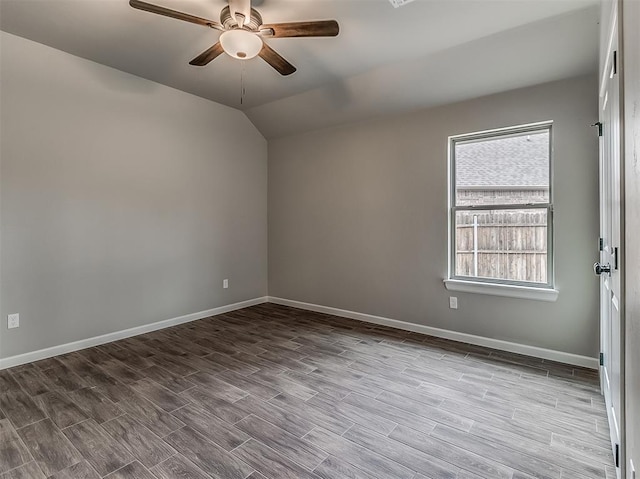 600 Mirano Ln, Edmond, OK 73034 - empty room featuring ceiling fan, lofted ceiling, and wood finished floors