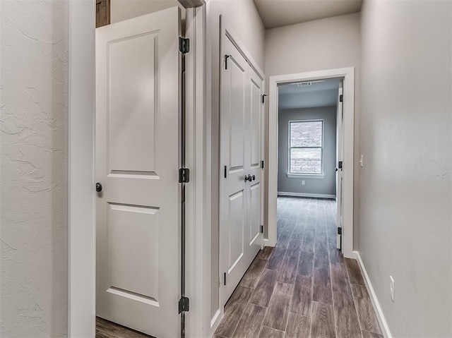 600 Mirano Ln, Edmond, OK 73034 - corridor featuring dark wood-type flooring and baseboards
